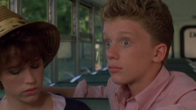 Anthony Michael Hall riding a bus with Molly Ringwald in Sixteen Candles