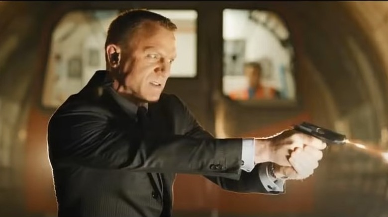 Daniel Craig firing a gun