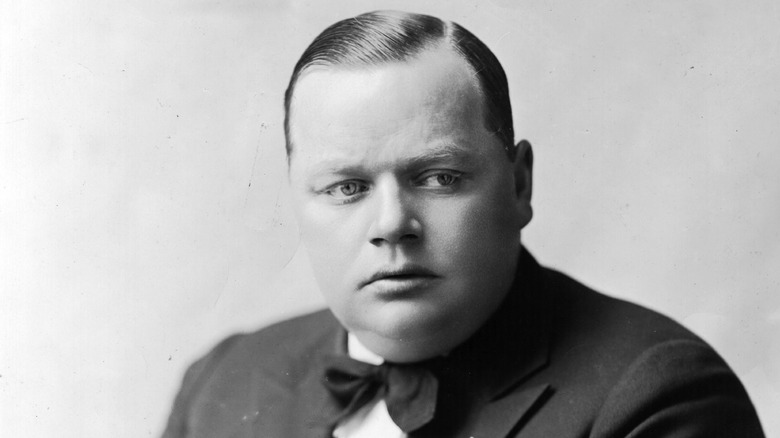 Roscoe 'Fatty' Arbuckle poses in suit