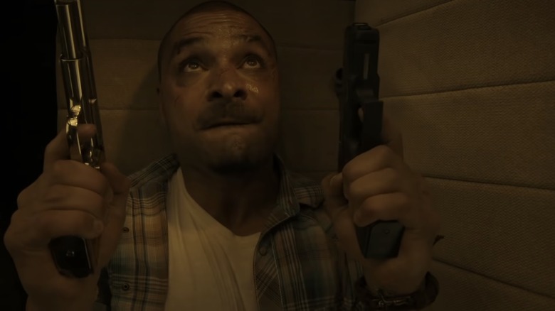 Michael Mando holds guns Better Call Saul