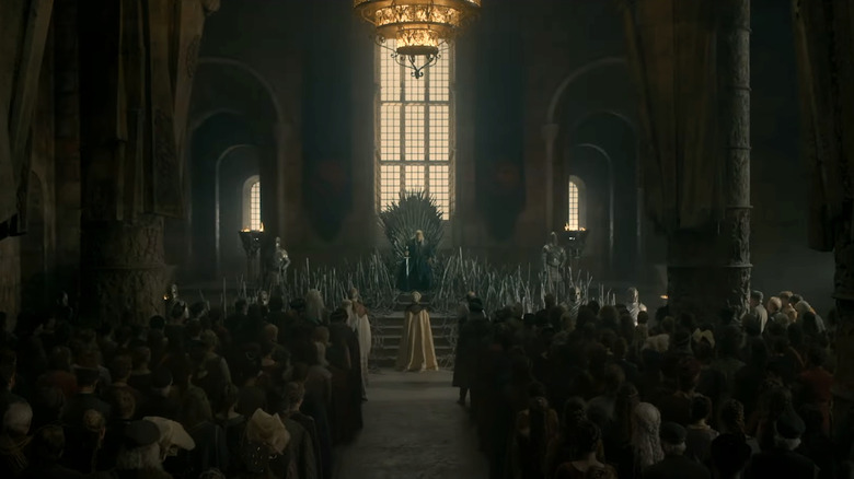 People standing before King Viserys I Targaryen in King's Landing