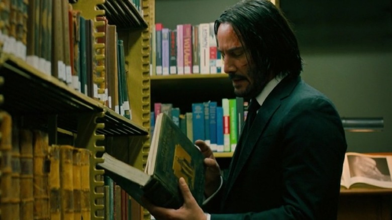 John Wick looks at book