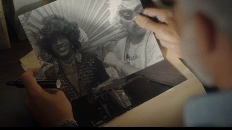 Gino holding photo of Marsha P. Johnson