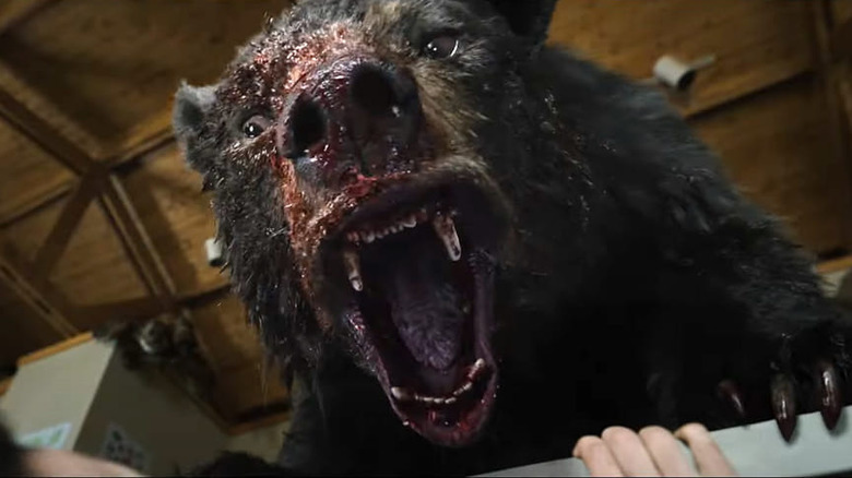 Cocaine Bear roars covered in blood