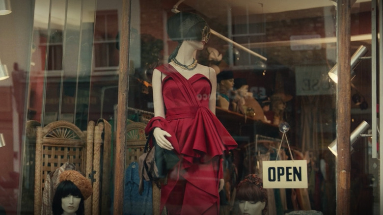 Red dress in shop window Cruella