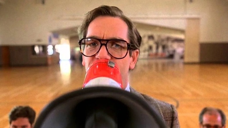 Huey Lewis holding a megaphone