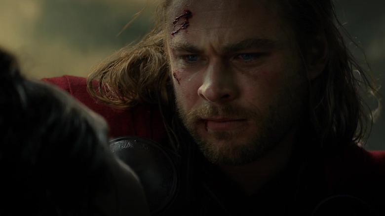 Thor looks sadly at Loki