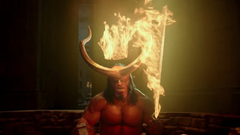 Hellboy with horns and a flaming sword