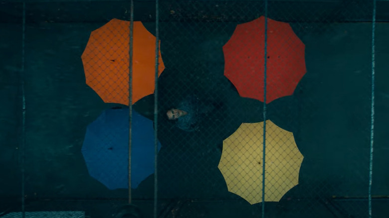 Arthur surrounded by colorful umbrellas