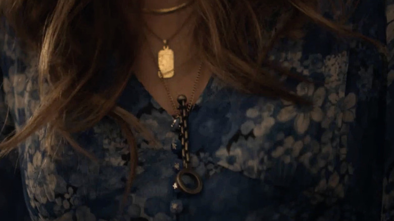 The chain key around Kinsey's neck