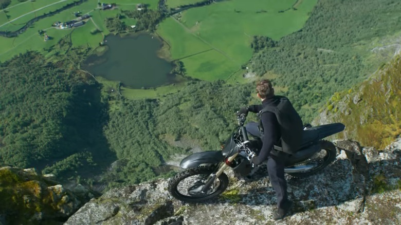 Ethan on motorcycle looking over cliff edge