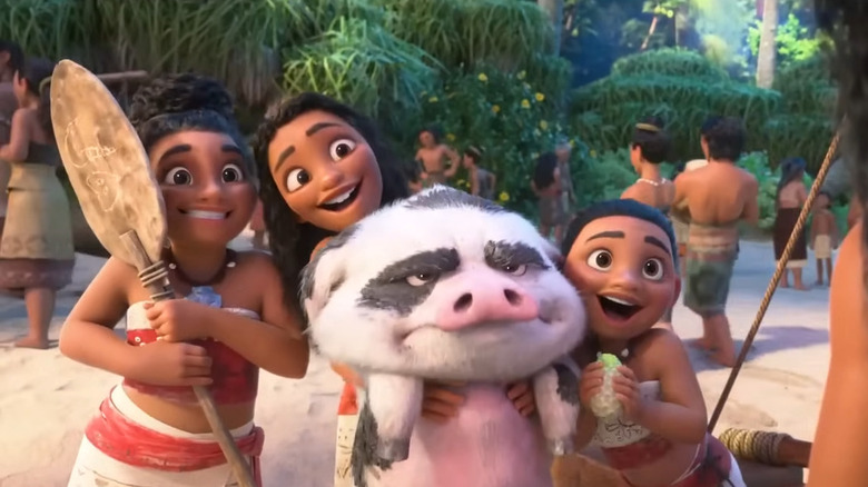 The Moana-Bes hold up a pig in "Moana 2"