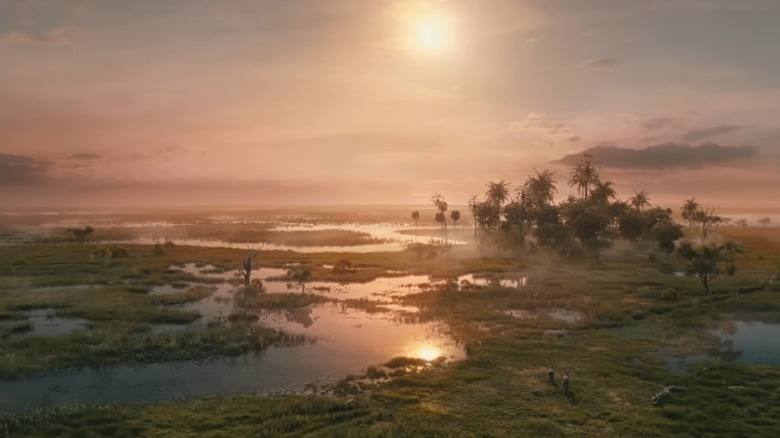 Mufasa: The Lion King's Mufasa and Eshe in a wetland at dusk