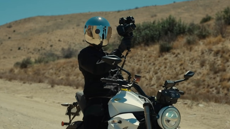 Motorcycle man filming the sky