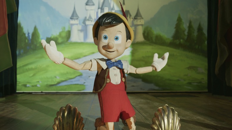 Pinocchio performing before castle backdrop