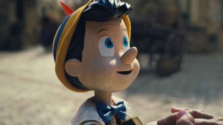 Pinocchio smiling eagerly at Geppetto