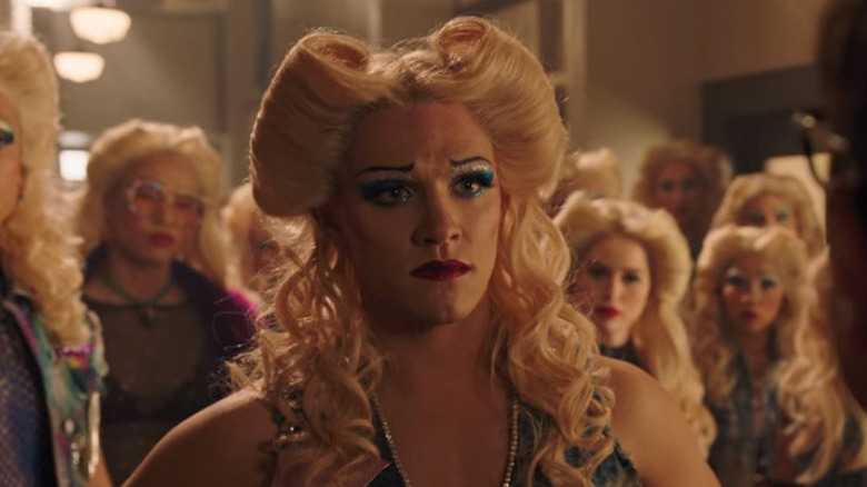 Kevin, dressed as Hedwig, frowning