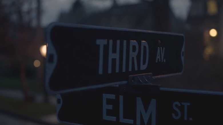 Street signs for Third Avenue and Elm Street