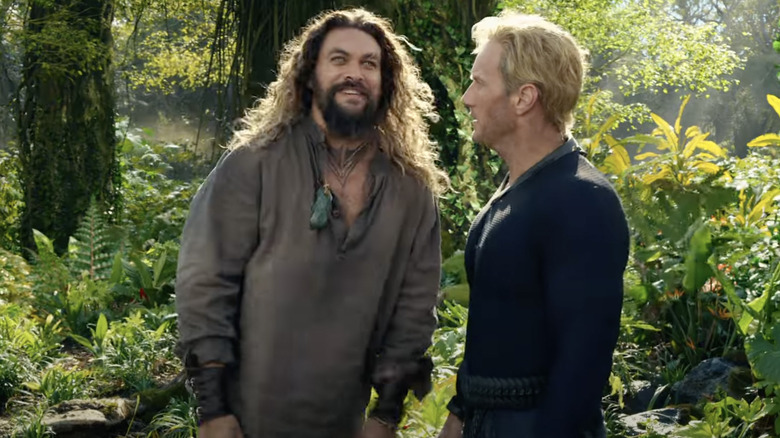 Orm and Arthur Curry standing in woods