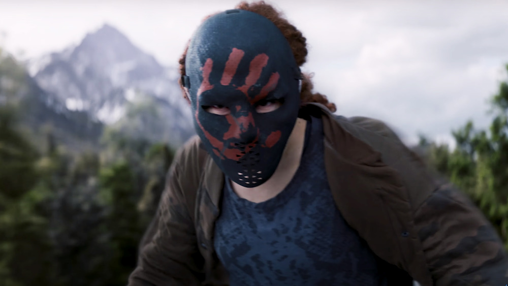 Character wearing a mask with a red handprint on it in the trailer for The Falcon and the Winter Soldier