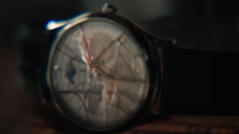 Stephen Strange stares at broken watch