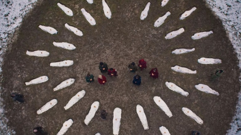 Bodies arranged in a circle on 'Wheel of Time'