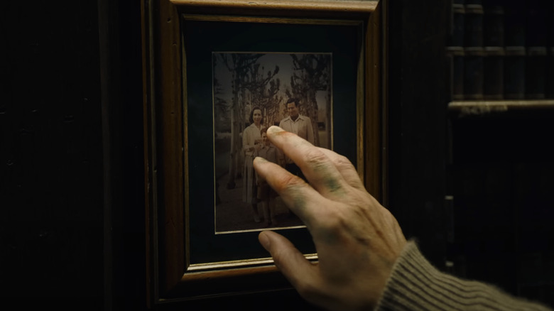 Bruce sees a photo of his parents