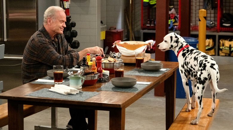 Frasier sits across from dalmatian