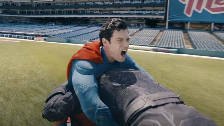 Superman battles a villain at a Metropolis baseball field in Superman (2025)