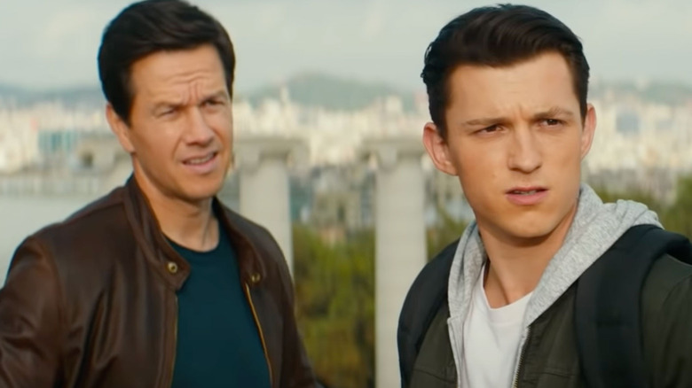 Mark Wahlberg and Tom Holland squinting in Uncharted