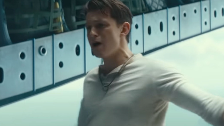 Tom Holland in a plane in Uncharted