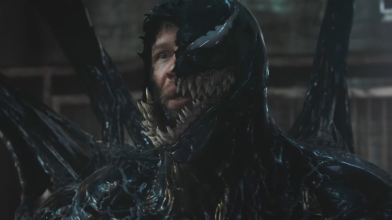 Venom and Eddie Brock snarling