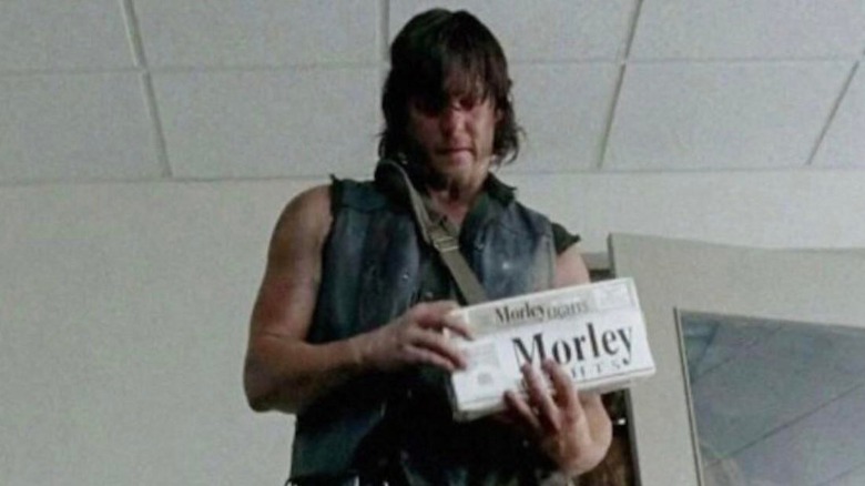 Daryl opens box of Morley cigarettes