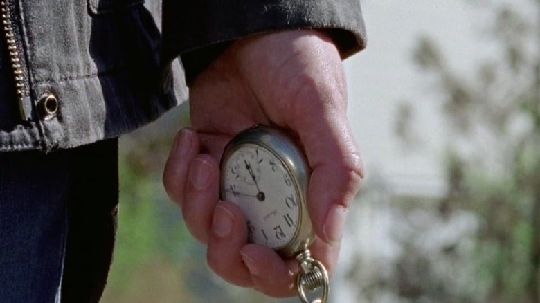 Maggie Rhee holds pocket-watch