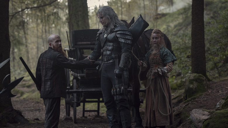 Henry Cavill shakes hands as Geralt of Rivia in The Witcher