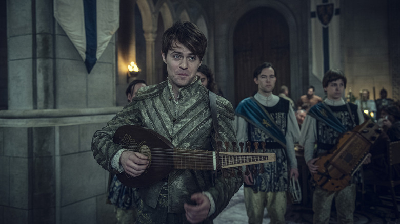 Joey Batey plays music as Jaskier in season 1 of The Witcher.