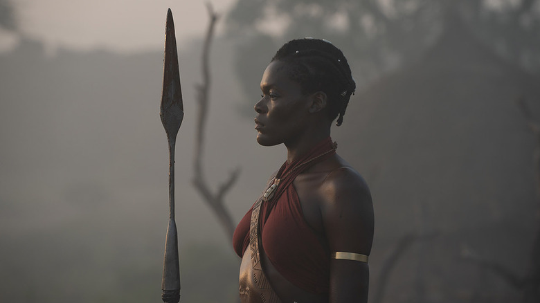 Sheila Atim's character holding a spear