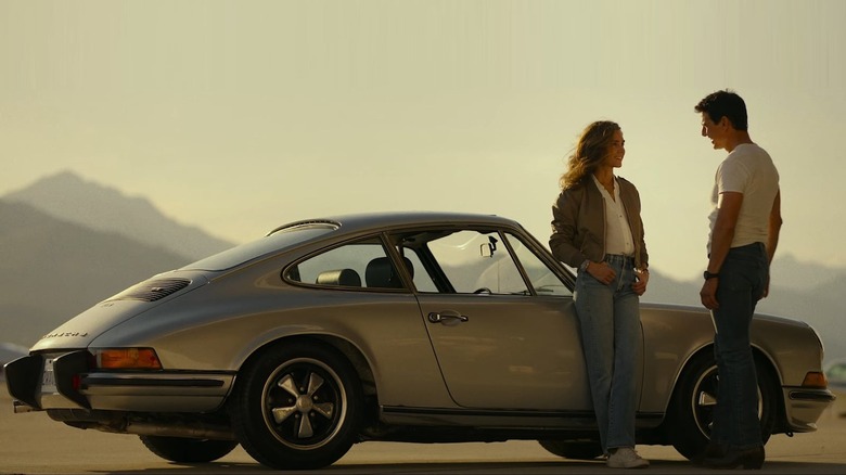 Penny and Maverick flirt by her car