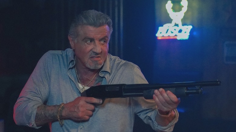 Sylvester Stallone holding gun