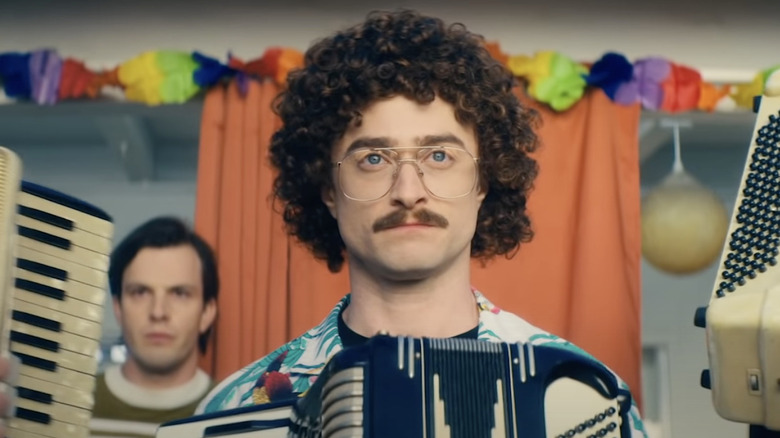 Daniel Radcliffe as "Weird Al" Yankovic holds accordion