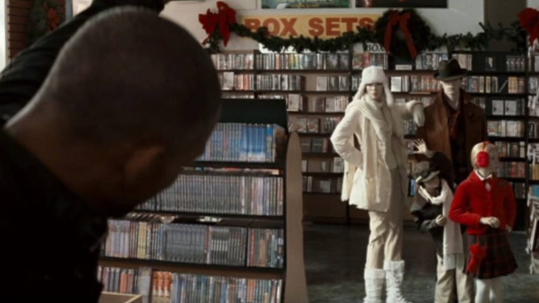 Smith in video store with mannequins