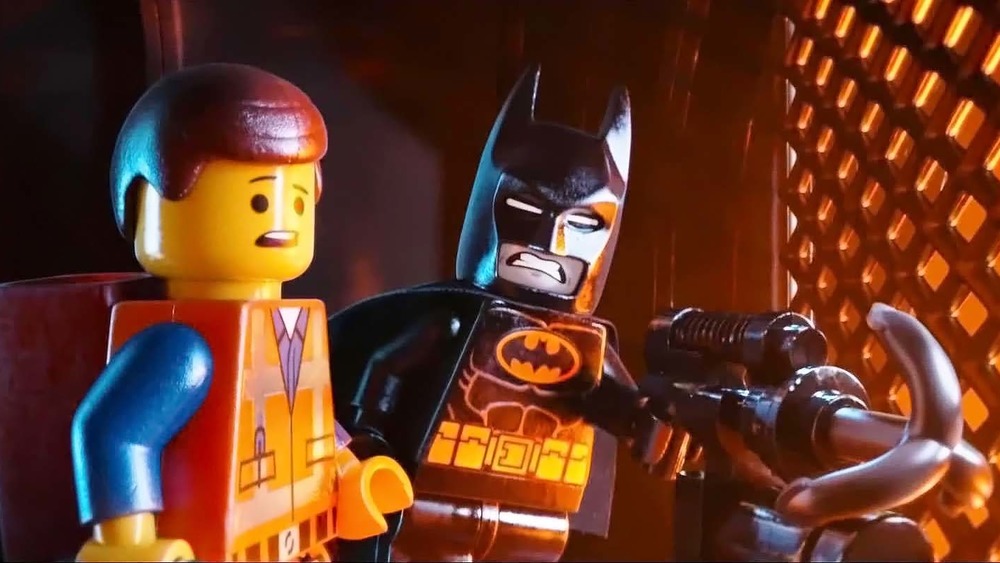 Emmet and Batman with his grappling hook