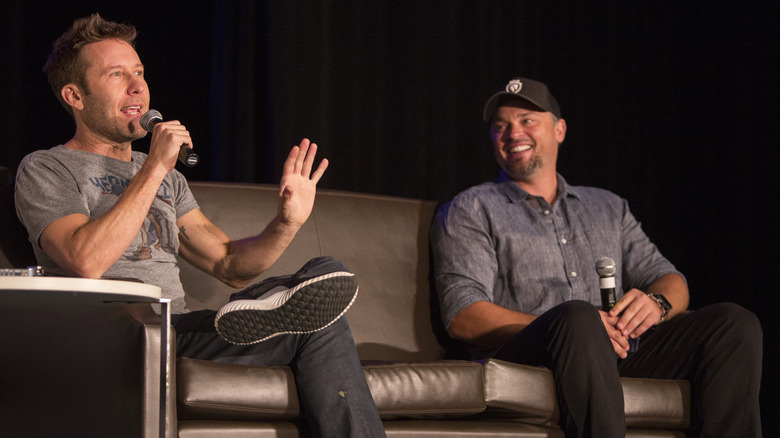 Michael Rosenbaum and Tom Welling talking onstage