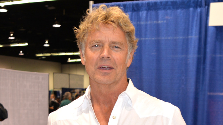 John Schneider talking white shirt