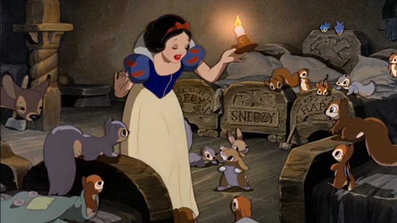 Snow White examines the house of the seven dwarves