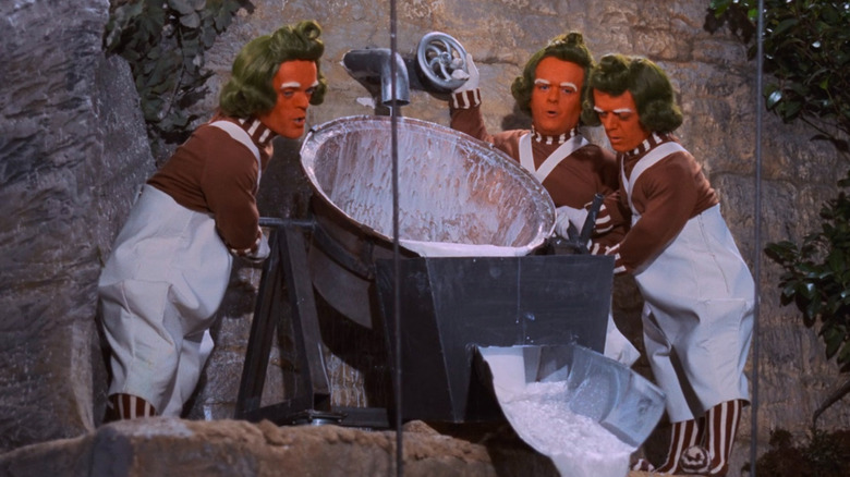 Oompa Loompas pouring liquid and singing