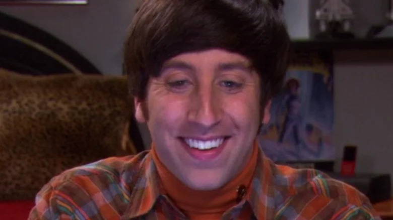 Simon Helberg grinning at laptop