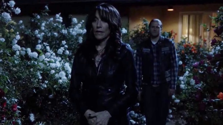 Gemma and Jax walk through rose garden