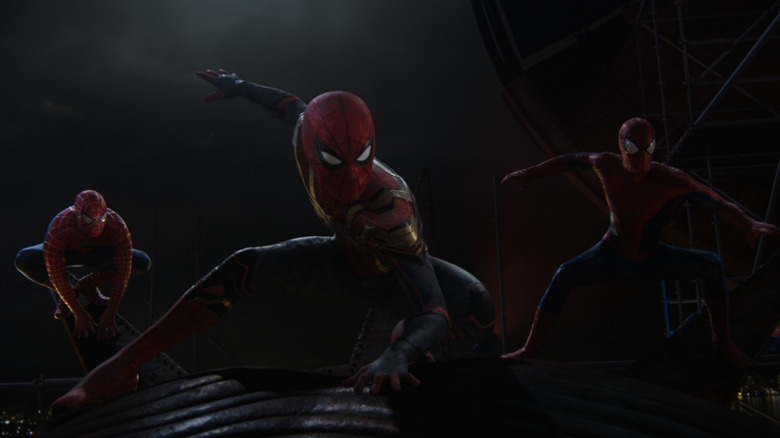 Three Spider-Men standing