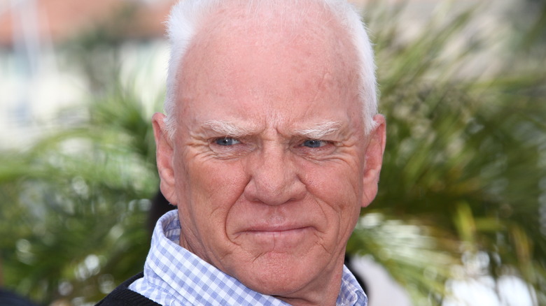 Malcolm McDowell squints into the sun